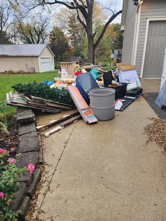 Dumpster being loaded with debris for Commercial Dumpster Rental in Cutten